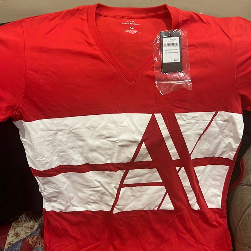 Brand new designer shirt never worn completely new.